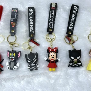 Set of two hero and cartoon character keychains with bright PVC figuSet of two hero and cartoon character keychains with bright PVC figures, accent charms and secure metal rings.res, accent charms and secure metal rings.
