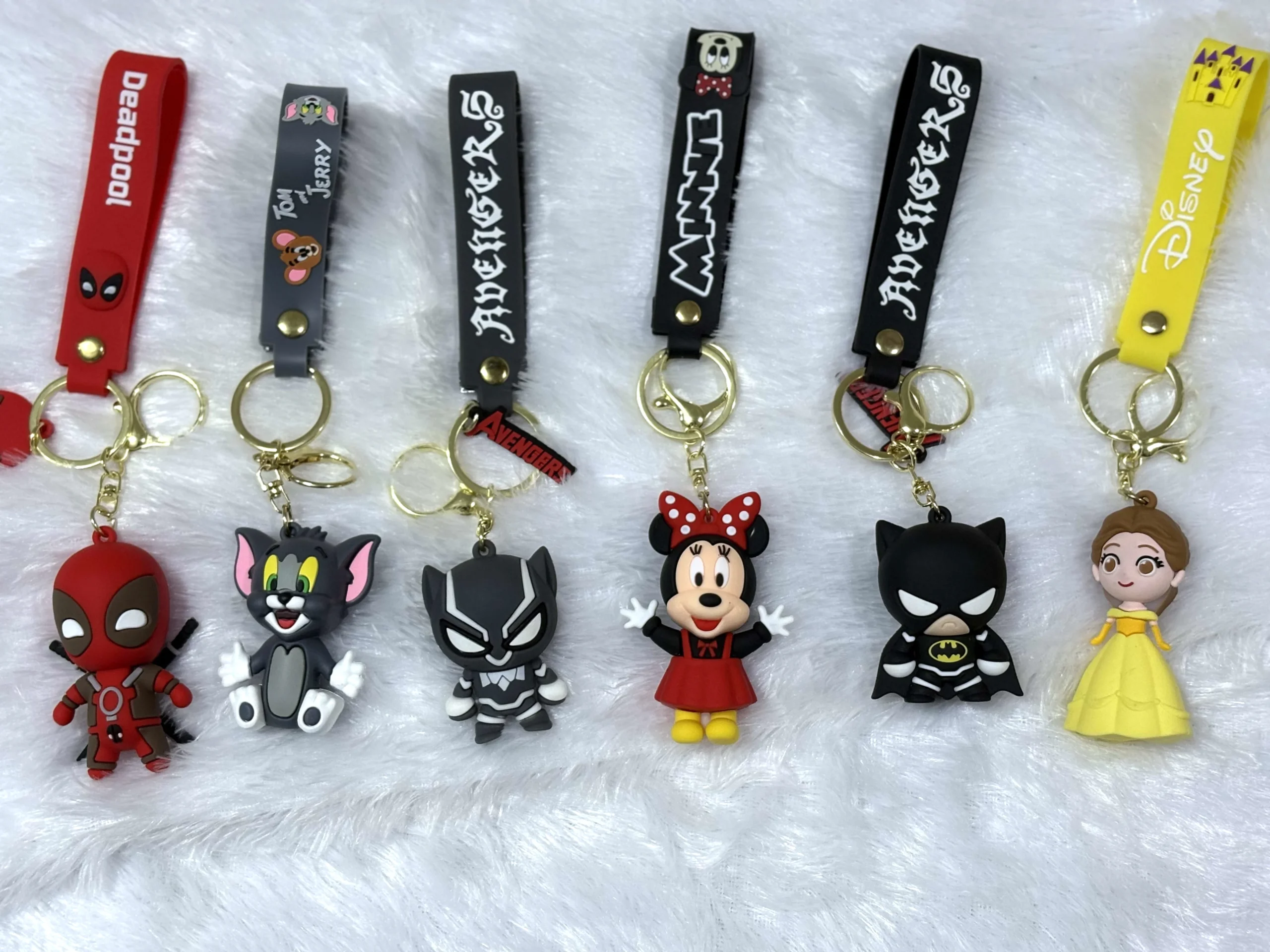 Set of two hero and cartoon character keychains with bright PVC figuSet of two hero and cartoon character keychains with bright PVC figures, accent charms and secure metal rings.res, accent charms and secure metal rings.